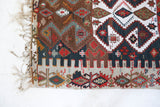 Vintage kilim rug in living room setting, old rug, antique rug, pastel colors, faded colors, Turkish rug, vintage rug, soft rug, Portland, Oregon, rug store, rug shop, local shop, earthy tones, earthy colors, warm colors
