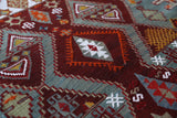 Vintage kilim rug in living room setting, old rug, antique rug, pastel colors, faded colors, Turkish rug, vintage rug, soft rug, Portland, Oregon, rug store, rug shop, local shop, earthy tones, earthy colors, warm colors