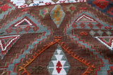 Vintage kilim rug in living room setting, old rug, antique rug, pastel colors, faded colors, Turkish rug, vintage rug, soft rug, Portland, Oregon, rug store, rug shop, local shop, earthy tones, earthy colors, warm colors