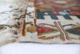 Vintage kilim rug in living room setting, old rug, antique rug, pastel colors, faded colors, Turkish rug, vintage rug, soft rug, Portland, Oregon, rug store, rug shop, local shop, earthy tones, earthy colors, warm colors