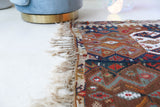 Vintage kilim rug in living room setting, old rug, antique rug, pastel colors, faded colors, Turkish rug, vintage rug, soft rug, Portland, Oregon, rug store, rug shop, local shop, earthy tones, earthy colors, warm colors