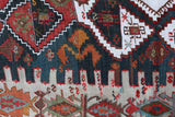 Vintage kilim rug in living room setting, old rug, antique rug, pastel colors, faded colors, Turkish rug, vintage rug, soft rug, Portland, Oregon, rug store, rug shop, local shop, earthy tones, earthy colors, warm colors