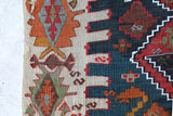 Vintage kilim rug in living room setting, old rug, antique rug, pastel colors, faded colors, Turkish rug, vintage rug, soft rug, Portland, Oregon, rug store, rug shop, local shop, earthy tones, earthy colors, warm colors