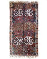 Vintage kilim rug in living room setting, old rug, antique rug, pastel colors, faded colors, Turkish rug, vintage rug, soft rug, Portland, Oregon, rug store, rug shop, local shop, earthy tones, earthy colors, warm colors