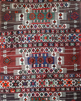 Vintage kilim rug in living room setting, old rug, antique rug, pastel colors, faded colors, Turkish rug, vintage rug, soft rug, Portland, Oregon, rug store, rug shop, local shop, earthy tones, earthy colors, warm colors