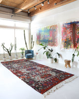 Vintage kilim rug in living room setting, old rug, antique rug, pastel colors, faded colors, Turkish rug, vintage rug, soft rug, Portland, Oregon, rug store, rug shop, local shop, earthy tones, earthy colors, warm colors