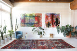 Vintage kilim rug in living room setting, old rug, antique rug, pastel colors, faded colors, Turkish rug, vintage rug, soft rug, Portland, Oregon, rug store, rug shop, local shop, earthy tones, earthy colors, warm colors