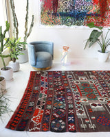 Vintage kilim rug in living room setting, old rug, antique rug, pastel colors, faded colors, Turkish rug, vintage rug, soft rug, Portland, Oregon, rug store, rug shop, local shop, earthy tones, earthy colors, warm colors