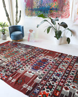 Vintage kilim rug in living room setting, old rug, antique rug, pastel colors, faded colors, Turkish rug, vintage rug, soft rug, Portland, Oregon, rug store, rug shop, local shop, earthy tones, earthy colors, warm colors