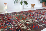 Vintage kilim rug in living room setting, old rug, antique rug, pastel colors, faded colors, Turkish rug, vintage rug, soft rug, Portland, Oregon, rug store, rug shop, local shop, earthy tones, earthy colors, warm colors