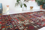 Vintage kilim rug in living room setting, old rug, antique rug, pastel colors, faded colors, Turkish rug, vintage rug, soft rug, Portland, Oregon, rug store, rug shop, local shop, earthy tones, earthy colors, warm colors