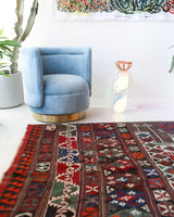 Vintage kilim rug in living room setting, old rug, antique rug, pastel colors, faded colors, Turkish rug, vintage rug, soft rug, Portland, Oregon, rug store, rug shop, local shop, earthy tones, earthy colors, warm colors