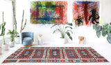 Vintage kilim rug in living room setting, bright colors, wild shaman, soft rug, bold color, Portland, Oregon, rug store, rug shop, local shop, vintage rug, modern kilim, warm colors, antique rug, antique kilim