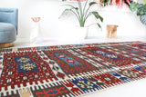 Vintage kilim rug in living room setting, bright colors, wild shaman, soft rug, bold color, Portland, Oregon, rug store, rug shop, local shop, vintage rug, modern kilim, warm colors, antique rug, antique kilim