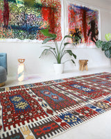 Vintage kilim rug in living room setting, bright colors, wild shaman, soft rug, bold color, Portland, Oregon, rug store, rug shop, local shop, vintage rug, modern kilim, warm colors, antique rug, antique kilim