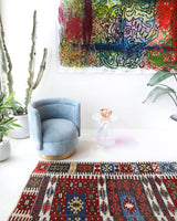Vintage kilim rug in living room setting, bright colors, wild shaman, soft rug, bold color, Portland, Oregon, rug store, rug shop, local shop, vintage rug, modern kilim, warm colors, antique rug, antique kilim