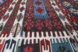 Vintage kilim rug in living room setting, bright colors, wild shaman, soft rug, bold color, Portland, Oregon, rug store, rug shop, local shop, vintage rug, modern kilim, warm colors, antique rug, antique kilim