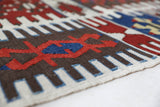 Vintage kilim rug in living room setting, bright colors, wild shaman, soft rug, bold color, Portland, Oregon, rug store, rug shop, local shop, vintage rug, modern kilim, warm colors, antique rug, antique kilim