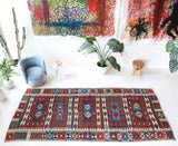 Vintage kilim rug in living room setting, bright colors, wild shaman, soft rug, bold color, Portland, Oregon, rug store, rug shop, local shop, vintage rug, modern kilim, warm colors, antique rug, antique kilim