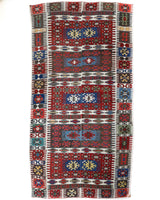 Vintage kilim rug in living room setting, bright colors, wild shaman, soft rug, bold color, Portland, Oregon, rug store, rug shop, local shop, vintage rug, modern kilim, warm colors, antique rug, antique kilim