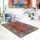 Vintage Turkish rug in a living room setting, pile rug, Turkish rug, vintage rug, portland, rug shop, bright colors, wild shaman, soft rug, bold color, Portland, Oregon, rug store, rug shop, local shop, antique rug
