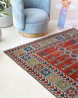 Vintage Turkish rug in a living room setting, pile rug, Turkish rug, vintage rug, portland, rug shop, bright colors, wild shaman, soft rug, bold color, Portland, Oregon, rug store, rug shop, local shop, antique rug
