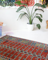 Vintage Turkish rug in a living room setting, pile rug, Turkish rug, vintage rug, portland, rug shop, bright colors, wild shaman, soft rug, bold color, Portland, Oregon, rug store, rug shop, local shop, antique rug