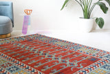 Vintage Turkish rug in a living room setting, pile rug, Turkish rug, vintage rug, portland, rug shop, bright colors, wild shaman, soft rug, bold color, Portland, Oregon, rug store, rug shop, local shop, antique rug