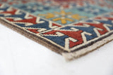 Vintage Turkish rug in a living room setting, pile rug, Turkish rug, vintage rug, portland, rug shop, bright colors, wild shaman, soft rug, bold color, Portland, Oregon, rug store, rug shop, local shop, antique rug