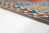 Vintage Turkish rug in a living room setting, pile rug, Turkish rug, vintage rug, portland, rug shop, bright colors, wild shaman, soft rug, bold color, Portland, Oregon, rug store, rug shop, local shop, antique rug