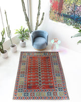 Vintage Turkish rug in a living room setting, pile rug, Turkish rug, vintage rug, portland, rug shop, bright colors, wild shaman, soft rug, bold color, Portland, Oregon, rug store, rug shop, local shop, antique rug