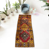 Vintage Turkish runner rug in a living room setting, pile rug, Turkish rug, vintage rug, portland, rug shop, bright colors, wild shaman, soft rug, bold color, Portland, Oregon, rug store, rug shop, local shop, antique rug