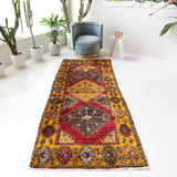 Vintage Turkish runner rug in a living room setting, pile rug, Turkish rug, vintage rug, portland, rug shop, bright colors, wild shaman, soft rug, bold color, Portland, Oregon, rug store, rug shop, local shop, antique rug