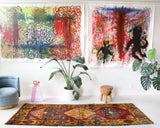 Vintage Turkish runner rug in a living room setting, pile rug, Turkish rug, vintage rug, portland, rug shop, bright colors, wild shaman, soft rug, bold color, Portland, Oregon, rug store, rug shop, local shop, antique rug