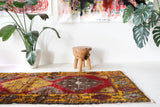 Vintage Turkish runner rug in a living room setting, pile rug, Turkish rug, vintage rug, portland, rug shop, bright colors, wild shaman, soft rug, bold color, Portland, Oregon, rug store, rug shop, local shop, antique rug