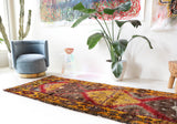 Vintage Turkish runner rug in a living room setting, pile rug, Turkish rug, vintage rug, portland, rug shop, bright colors, wild shaman, soft rug, bold color, Portland, Oregon, rug store, rug shop, local shop, antique rug