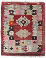 Vintage kilim rug in living room setting, bright colors, wild shaman, soft rug, bold color, Portland, Oregon, rug store, rug shop, local shop, vintage rug, modern kilim, warm colors, antique rug, antique kilim