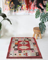 Vintage kilim rug in living room setting, bright colors, wild shaman, soft rug, bold color, Portland, Oregon, rug store, rug shop, local shop, vintage rug, modern kilim, warm colors, antique rug, antique kilim