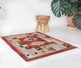 Vintage kilim rug in living room setting, bright colors, wild shaman, soft rug, bold color, Portland, Oregon, rug store, rug shop, local shop, vintage rug, modern kilim, warm colors, antique rug, antique kilim