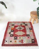 Vintage kilim rug in living room setting, bright colors, wild shaman, soft rug, bold color, Portland, Oregon, rug store, rug shop, local shop, vintage rug, modern kilim, warm colors, antique rug, antique kilim