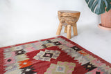 Vintage kilim rug in living room setting, bright colors, wild shaman, soft rug, bold color, Portland, Oregon, rug store, rug shop, local shop, vintage rug, modern kilim, warm colors, antique rug, antique kilim