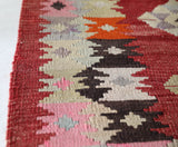 Vintage kilim rug in living room setting, bright colors, wild shaman, soft rug, bold color, Portland, Oregon, rug store, rug shop, local shop, vintage rug, modern kilim, warm colors, antique rug, antique kilim