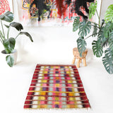 Vintage kilim rug in room decor setting, old rug, antique rug, pastel colors, faded colors, Turkish rug, vintage rug, soft rug, Portland, Oregon, rug store, rug shop, local shop,  antique kilim rug, bold colors, bright colors, faded colors