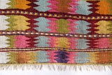 Vintage kilim rug in room decor setting, old rug, antique rug, pastel colors, faded colors, Turkish rug, vintage rug, soft rug, Portland, Oregon, rug store, rug shop, local shop,  antique kilim rug, bold colors, bright colors, faded colors