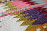 Vintage kilim rug in room decor setting, old rug, antique rug, pastel colors, faded colors, Turkish rug, vintage rug, soft rug, Portland, Oregon, rug store, rug shop, local shop,  antique kilim rug, bold colors, bright colors, faded colors