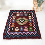 Vintage kilim rug in living room setting, bright colors, wild shaman, soft rug, bold color, Portland, Oregon, rug store, rug shop, local shop, vintage rug, modern kilim, warm colors, antique rug, antique kilim