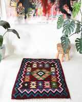 Vintage kilim rug in living room setting, bright colors, wild shaman, soft rug, bold color, Portland, Oregon, rug store, rug shop, local shop, vintage rug, modern kilim, warm colors, antique rug, antique kilim