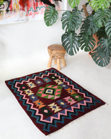 Vintage kilim rug in living room setting, bright colors, wild shaman, soft rug, bold color, Portland, Oregon, rug store, rug shop, local shop, vintage rug, modern kilim, warm colors, antique rug, antique kilim
