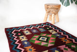 Vintage kilim rug in living room setting, bright colors, wild shaman, soft rug, bold color, Portland, Oregon, rug store, rug shop, local shop, vintage rug, modern kilim, warm colors, antique rug, antique kilim