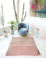 Vintage kilim rug in living room setting, old rug, antique rug, pastel colors, faded colors, Turkish rug, vintage rug, soft rug, Portland, Oregon, rug store, rug shop, local shop, earthy tones, earthy colors, warm colors